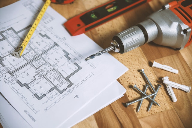 A floor plan and tools and a table.