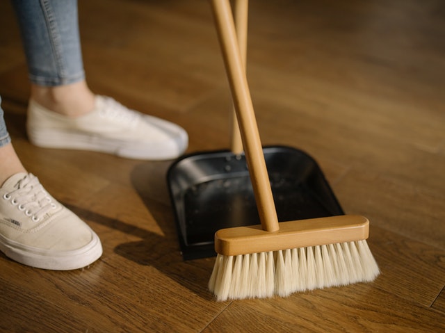 White sneakers and a broom.