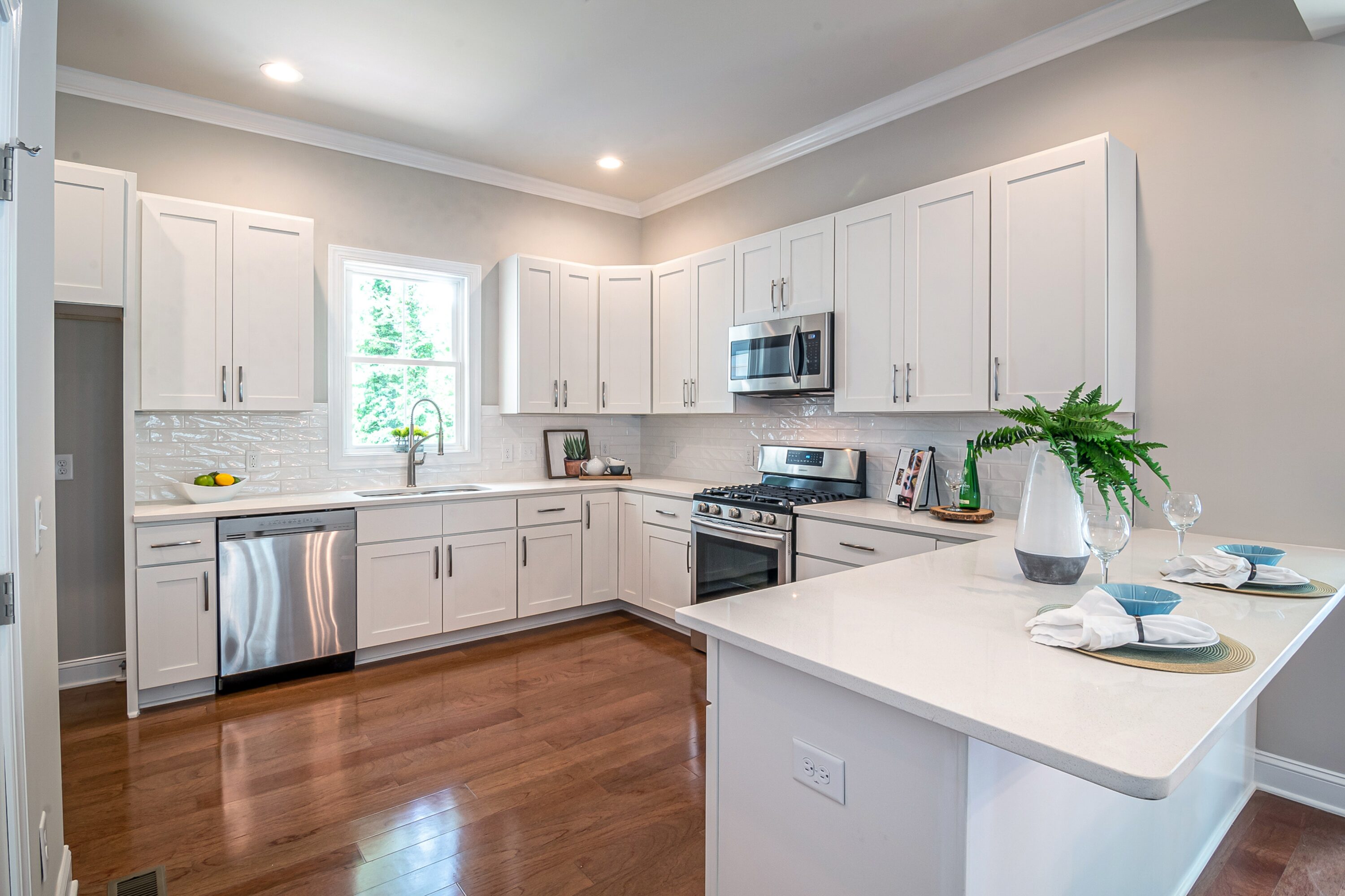 A beautiful new kitchen with white cabinets