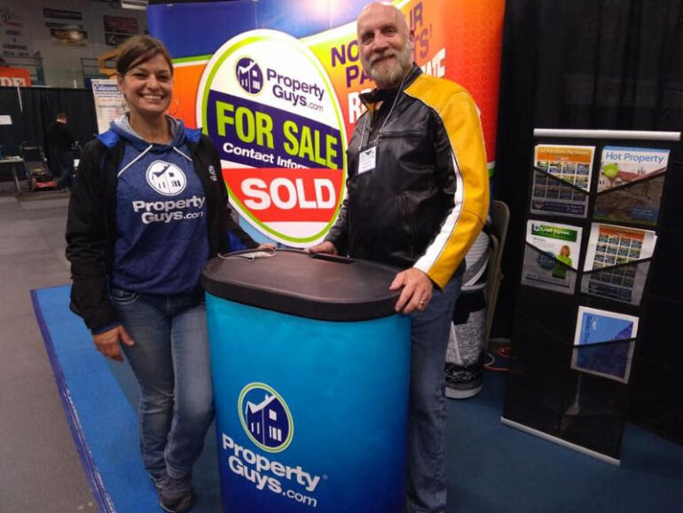 Rick Davies at trade show with PropertyGuys.com