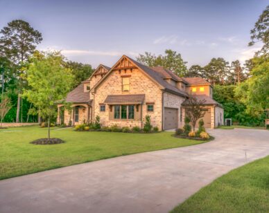 A brown house with a yard