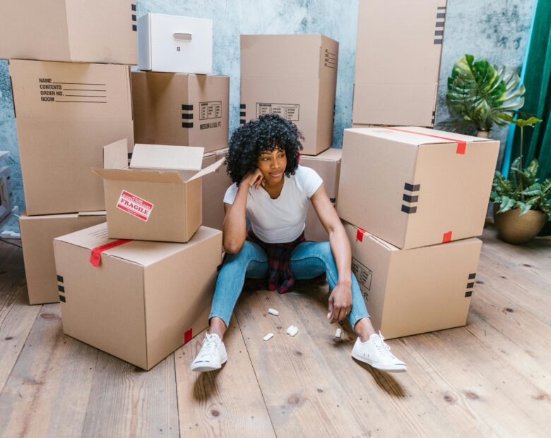 a woman thinking about what to do when moving dates do not align with closing dates